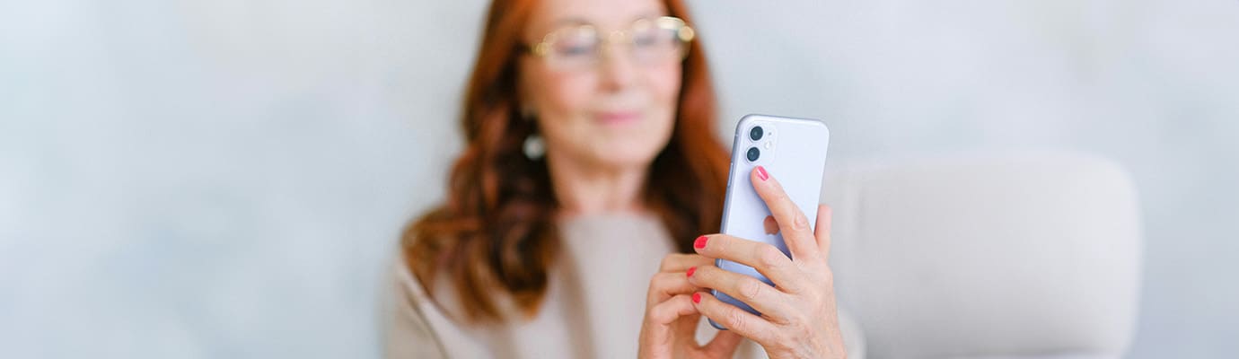 blurry redhead with cell phone